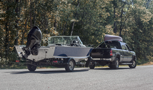 black truck towing boat