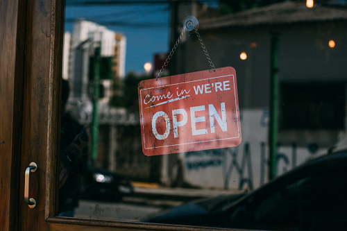 an open sign on a shop window