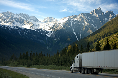 a truck with a mountain in the background